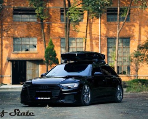 Cool black Audi A6 allroad bagged modern posture