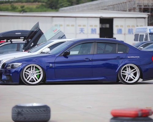 Blue old BMW 3 Series bagged colorful